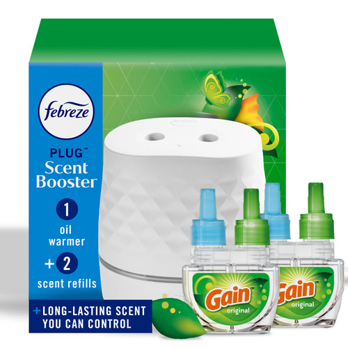 White Febreze Plug Scent Booster oil warmer shown with three Gain refill bottles and green packaging behind on a white background.