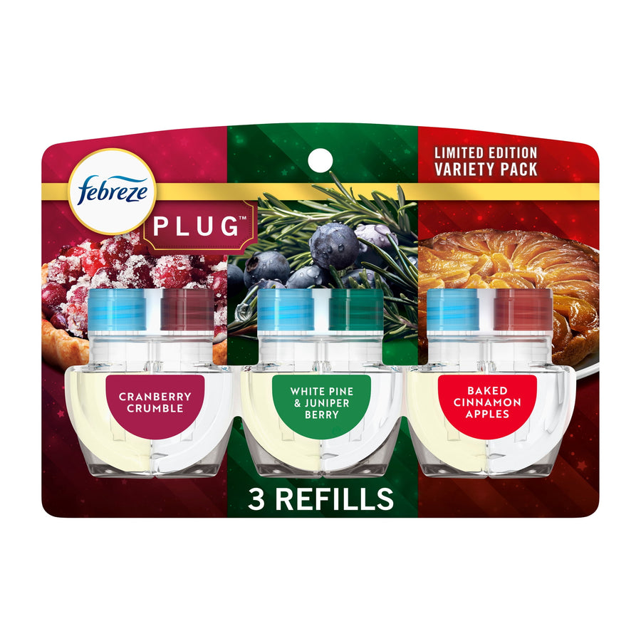 Packaged Febreze Plug refill trio showing three clear oil refill cartridges with labeled scent badges on holiday-themed backing card