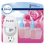 Febreze plug-in starter warmer and three replacement scented oil refill bottles on floral pink background