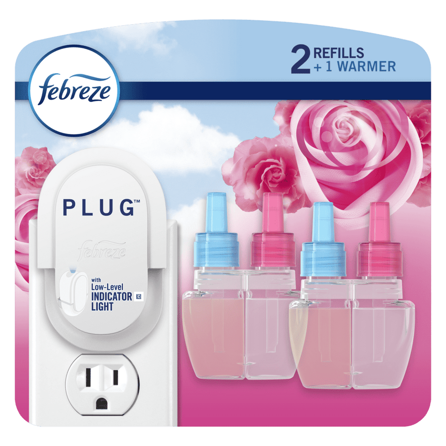 Febreze plug-in starter warmer and three replacement scented oil refill bottles on floral pink background