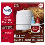 Retail packaging front for Febreze Plug Scent Booster showing the white oil warmer, two refills and baked cinnamon apples imagery.