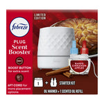Febreze Plug Scent Booster starter kit box showing white diamond-textured oil warmer and baked cinnamon apples scented refill.