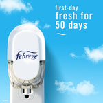 Top-down view of a Febreze plug-in device against a blue sky background with text claiming first-day fresh for 50 days