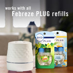Febreze Plug device displayed next to two packaged refills including a Gain-scent refill with headline about compatibility.