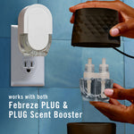 Hands holding Febreze PLUG top and a dual refill bottle beside a wall-mounted Febreze PLUG unit showing compatibility