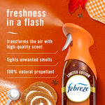 Febreze Air Mist Pumpkin Roll bottle on an orange background with 'freshness in a flash' product text