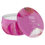 Close-up of Febreze Romance & Desire candle tin with lid showing product name, brand logo and 11 oz marking on the label