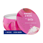 Febreze Romance & Desire pink candle tin with lid propped showing label and a banner reading ‘4 wicks • even burn’