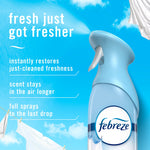 Close-up of a light blue Febreze Air Mist bottle spraying with text listing benefits and a sky-themed background.