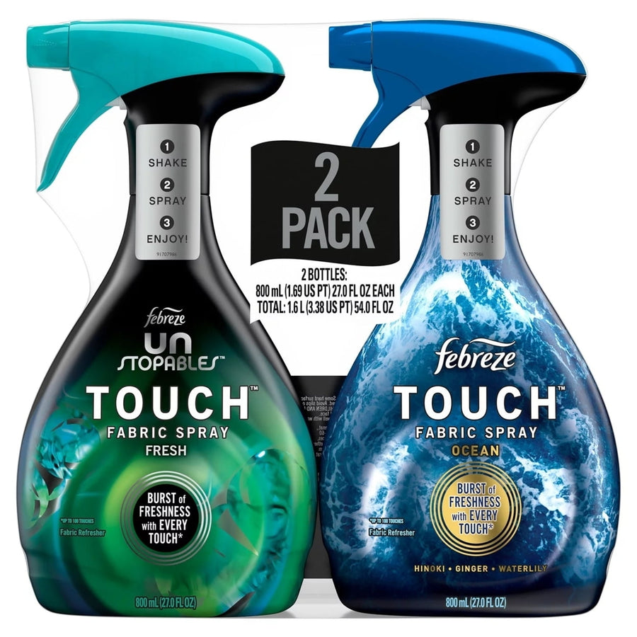 Two Febreze Touch fabric spray bottles in a retail 2-pack, ocean and fresh variants visible on front labels.