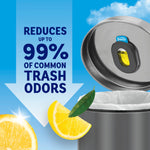 Close-up of a trash can lid with Febreze holder and lemon slices, graphic text claiming reduction of common trash odors