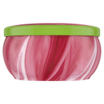 Side profile studio image of Febreze Sweet Watermelon Vine marbled pink tin candle with a green lid, no label text visible