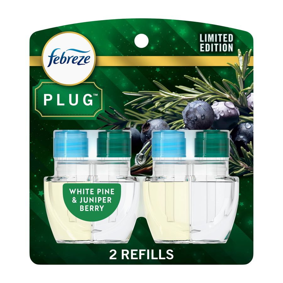 Febreze Plug refill twin pack on green packaging labeled White Pine & Juniper Berry, two clear oil refill bottles visible