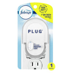 Febreze white plug-in oil warmer in blister packaging with blue sky background