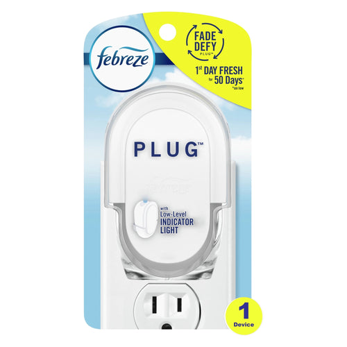 Febreze white plug-in oil warmer in blister packaging with blue sky background
