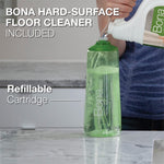 Refillable translucent green Bona cartridge being filled from a Bona cleaner bottle with text calling out included hard-surface floor cleaner