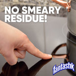 Finger touching a glossy stovetop surface with text 'No smeary residue!' and Fantastik logo in the corner