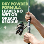 Close-up of hands holding a fishing rod beside water with text promoting a dry powder formula that leaves no greasy residue