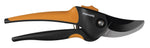 Orange and black Fiskars bypass pruner on white background showing curved precision-ground blade and softgrip handles