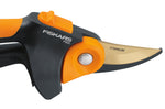 Tight close-up of Fiskars pruner pivot area showing FISKARS branding, easy-open lock and titanium-coated blade