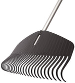 Angled close-up of Fiskars poly rake head and aluminum handle showing curved tines and molded ribbing
