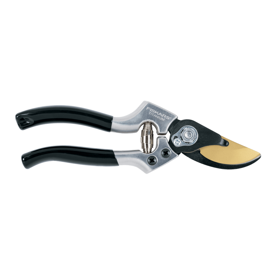 Fiskars titanium-coated bypass pruner with black handles shown on white background.