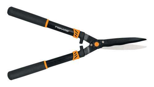 Pair of Fiskars wavy-blade hedge shears with black handles and orange accents on a white background