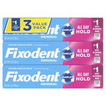 Three horizontally stacked Fixodent Original denture adhesive tubes/boxes showing '3 value pack' and 'All Day Hold' branding.