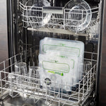 FoodSaver reusable bags placed inside a dishwasher rack alongside glassware to illustrate cleaning compatibility