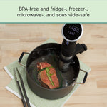 Sous vide setup showing a FoodSaver-sealed bag with a piece of meat submerged in a pot and an immersion circulator
