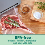 Raw ribeye steak sealed in a textured FoodSaver vacuum bag on a wooden counter with herbs and seasoning bowls nearby.