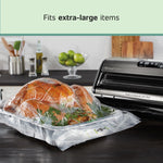 Vacuum-sealed turkey on a tray next to a FoodSaver machine with headline 'Fits extra-large items'