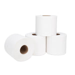 four white toilet paper rolls stacked on a white background