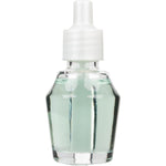 Straight-on view of a clear plug-in fragrance oil refill bottle with pale green liquid and white cap on a white background