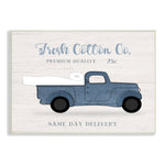 Illustration of a vintage blue pickup truck carrying a roll of toilet paper with text 'Fresh Cotton Co.'