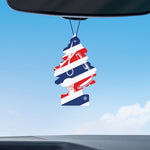 Fresh Shave Little Trees air freshener suspended from a rearview mirror against a blue sky background
