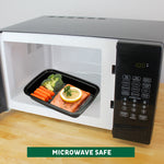 Black meal prep container with food inside placed in a microwave shown with door open and microwave control panel visible