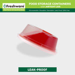 Angled clear Freshware container with lid shown tipped on its side with red gelatin, labeled leak-proof in the graphic