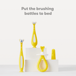 Studio product lineup showing three yellow Frida Baby toothbrushes and a training toothbrush on white podiums with headline text