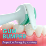 Close-up demo of a Frida flosser head with a gum bumper engaging model teeth, overlay text reads “GUM BUMPER.”