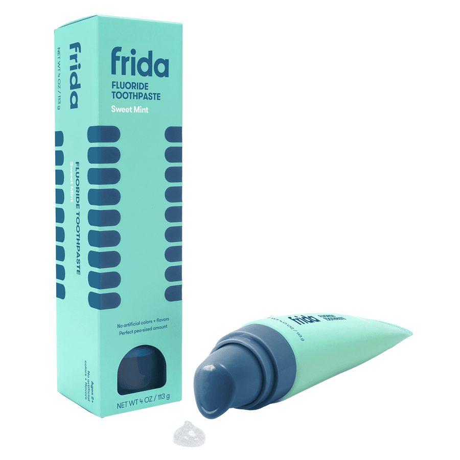 Frida sweet mint fluoride toothpaste tube and matching teal boxed packaging on white