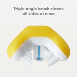 Macro view of the yellow toothbrush head showing triple-angle bristles cleaning all sides at once