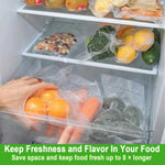 Refrigerator drawers stocked with various vacuum-sealed bags containing fruit, vegetables and nuts to show storage use