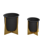 Front view of two black metal planters in textured gold stands, larger and smaller sizes displayed on white background.