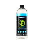 Clear plastic bottle of FunkAway Laundry Booster with black label, green logo and blue accent on white background