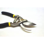 Open G & F forged bypass pruner showing both cutting blade and counter blade with black handles and yellow trim.