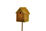 Small antique-brass miniature metal birdhouse on a thin stake against a white background