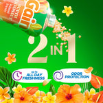 Tilted Gain scent booster bottle pouring beige fragrance beads over green background with floral accents