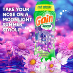 Gain Moonlight Breeze scent booster bottle on a purple floral background with promotional text inviting a moonlight summer stroll