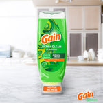 Gain EZ-Squeeze dish soap bottle placed on a kitchen countertop with blurred kitchen background, front label visible